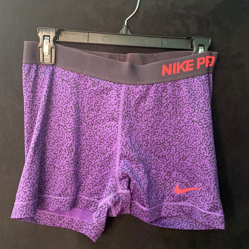 Purple and black spotted Nike pros